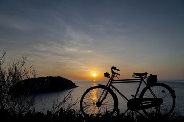 Fototapeta na wymiar Silhouette Bicycle at sunset background