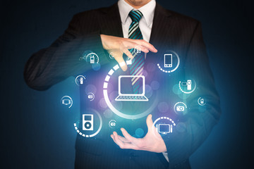 holding digital media icons