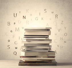 Books with flying letters on vintage background