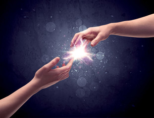 Hands reaching to light a spark