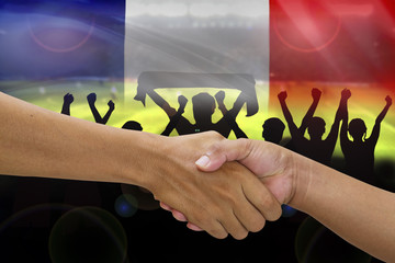 handshake in a business opponent team players shaking hand on si