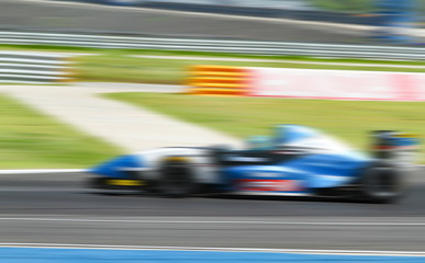 car racing on the road with motion blur and Radial blu