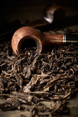 Pipe on tobacco pile