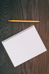 blank notepad on wood table