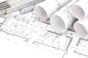 architectural background with plan, blueprint rolls, folding rul