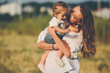 Fototapeta premium mother and daughter on a rural road