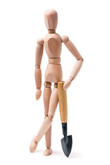 Wooden man with a shovel on a white background