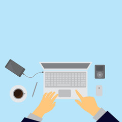 Workplace concept. Top view laptop, notebook, pencil, mobile phone, hands,blue background