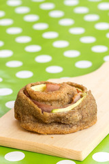 Selective focus on homemade pastry over green tablecloth