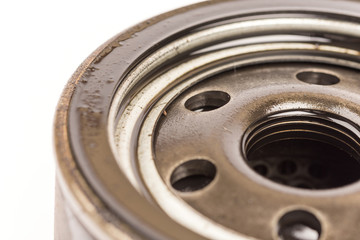 Macro close up car oil filter over white background