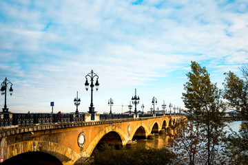 Old stony bridge in Bordeaux, France Europe