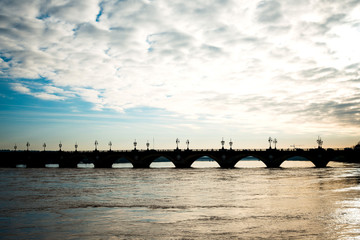 Fototapeta na wymiar Old stony bridge in Bordeaux, France Europe