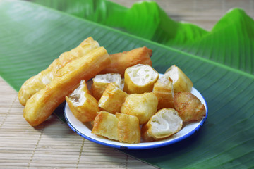 chinese deep fried dough sticks with sweet milk. fried bread stick or 