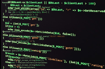 Programming code on black screen, green text