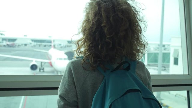 Woman Traveller Waiting for Flight at the Airport