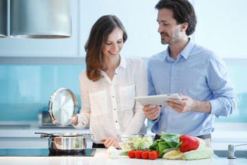 Couple cooking dinner