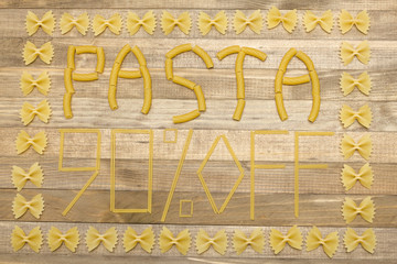 pasta  ninety percent off text made of raw pasta