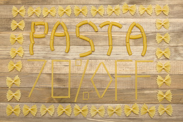 pasta  seventy percent off text made of raw pasta