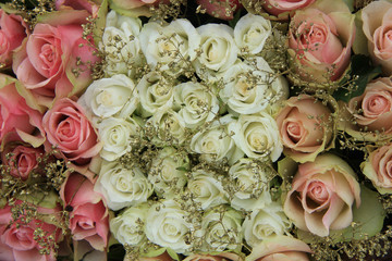 Mixed pink roses in bridal arrangement