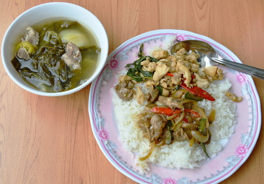 spicy stir fried chicken with basil leaf and pickled cabbage soup