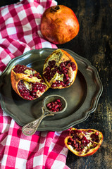 Fresh pomegranate on vintage plate