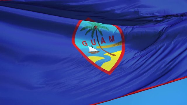 Guam flag waving in slow motion against clean blue sky, seamlessly looped, close up, isolated on alpha channel with black and white luminance matte, perfect for film, news, digital composition