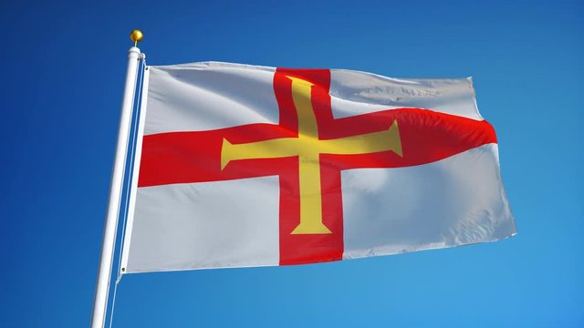 Guernsey flag waving in slow motion against clean blue sky, seamlessly looped, close up, isolated on alpha channel with black and white luminance matte, perfect for film, news, digital composition