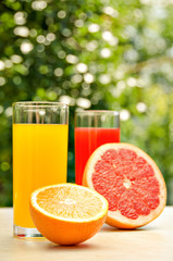 Fresh grapefruit and orange juice. Vitamins for health.
