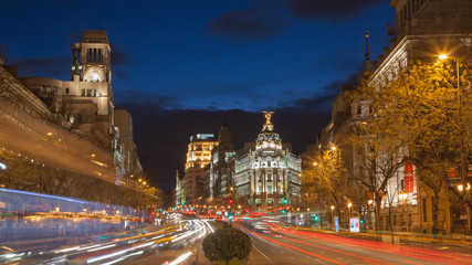 MADRID, SPAIN - MARCH 9, 2013:  Look from Plaza de Cibeles to Cale de Alcala street and Metropolis building in dusk.