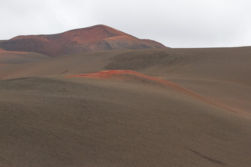 Fototapeta na wymiar Desert stone volcanic landscape in Lanzarote, Canary Islands 