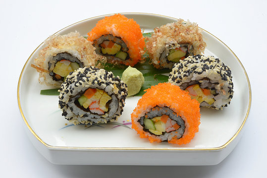 Traditional fresh japanese sushi rolls isolated on white background. 