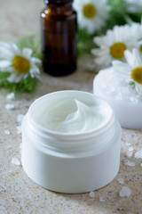 Face cream with chamomile essential oil bottle of aromatherapy a
