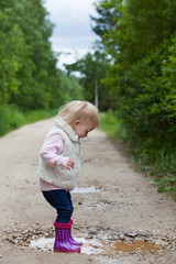 Happy smiling portrait of a 2 year old blonde girl