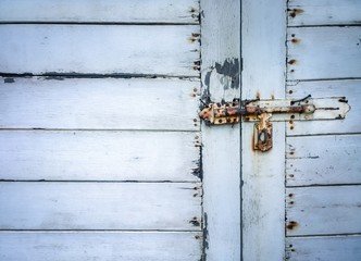 Close up of rusted keyhole on white wooden door (keyhole, rusted, door)