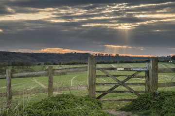 Fototapeta na wymiar Beautiful English countryside landscape over fields at sunset