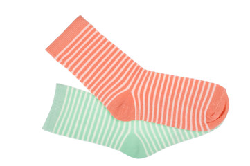 Pink and green striped childish socks isolated.