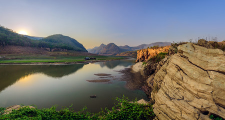 beautiful sunset at mountains and river