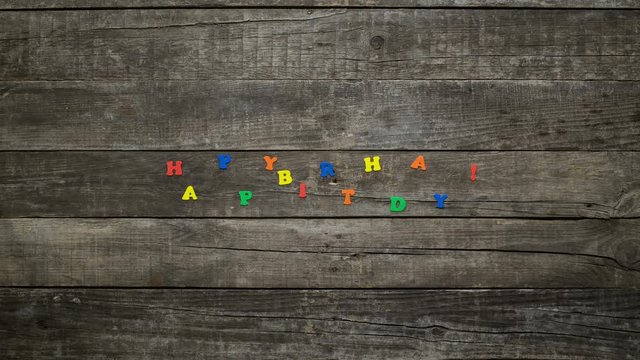 Happy Birthday animation on wooden boards
