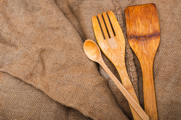 Kitchen wooden spoon on texture background