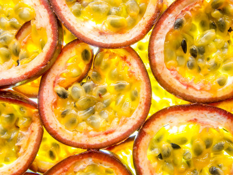 back lit slices of ripe maracuja passion fruit