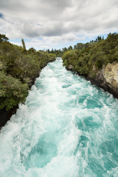 Side view of the rushing wild stream of Huka Falls near Lake Tau