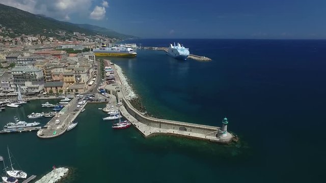 Aerial Flight over historical city of Bastia, important harbour on Corsica island, France, Europe 