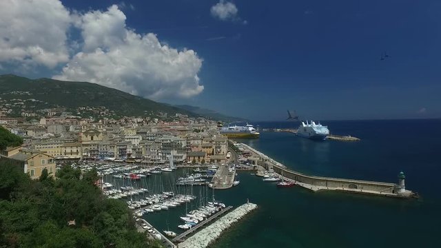 Aerial Flight over historical city of Bastia, important harbour on Corsica island, France, Europe 