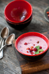 Wild strawberries with sour cream
