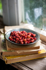 Fresh wild strawberries on a plate