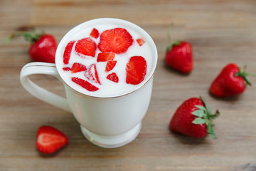 Ceramic Cup of Yogurt,Red Fresh Strawberries on the Wooden Background.Breakfast Organic Healthy Food.Cooking Vitamins Ingredients.Summer Fruits.Selective Focus