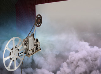 old film projector in a retro movie theater with a white screen with a red curtain mock-up 