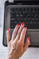 Woman hands on laptop