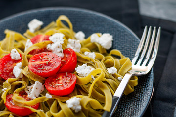 Pasta with fried tomatoes and feta cheese