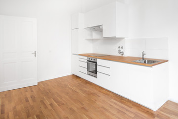 Fototapeta na wymiar modern white kitchen - home interior